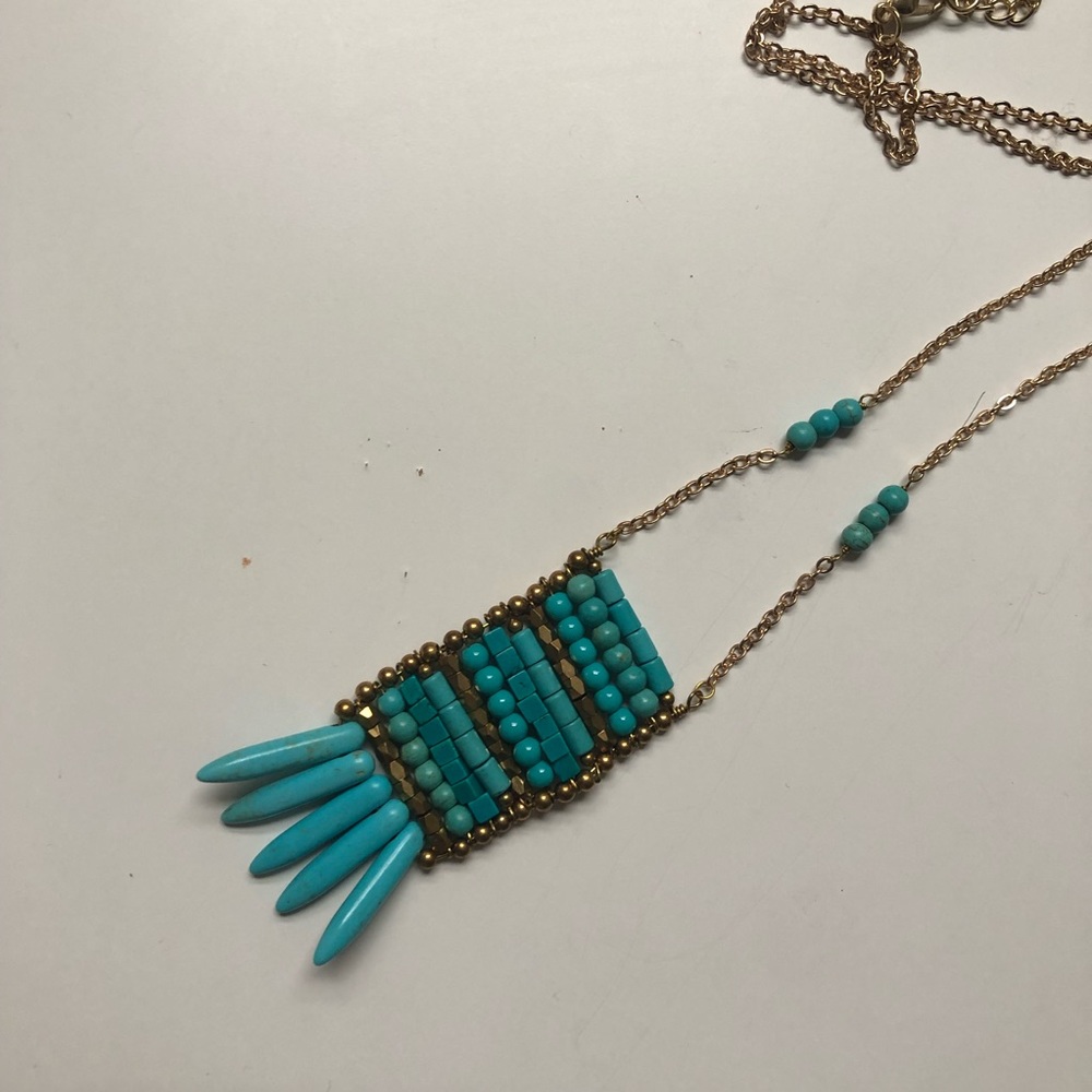 Long gold necklace